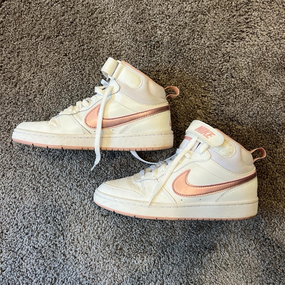 Pink and white Nike mid rises